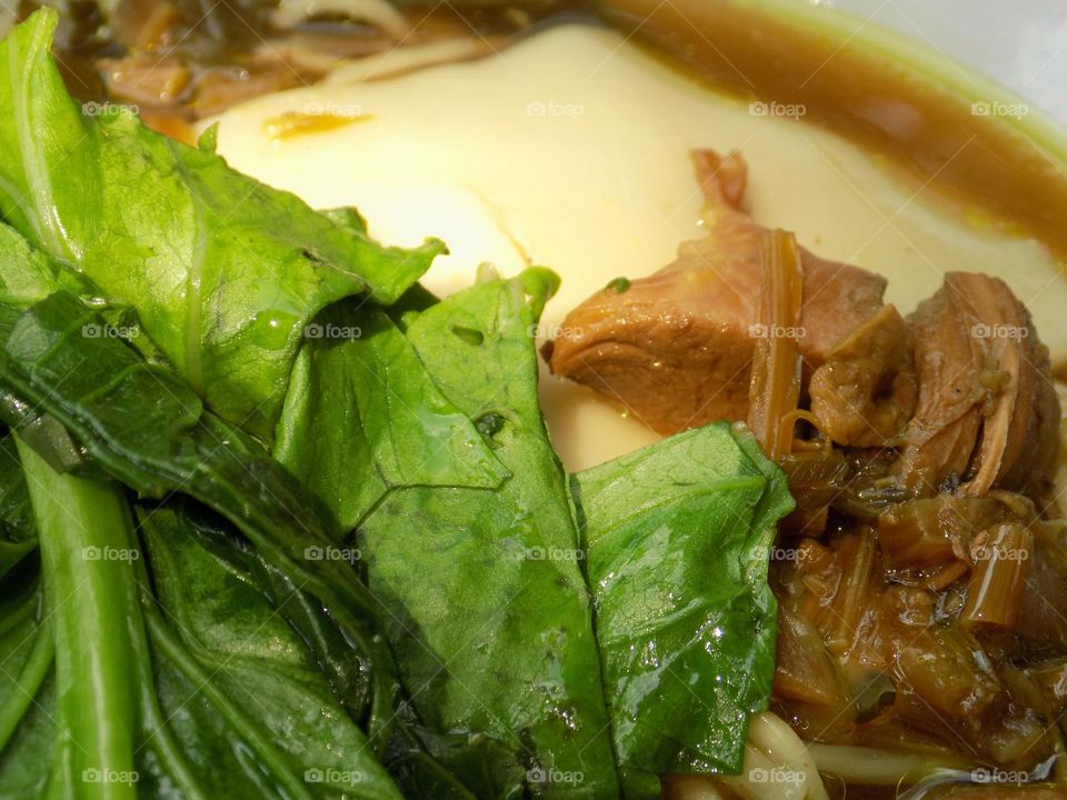 Green mustard greens, chicken and dumplings add to the pleasure of chicken noodles