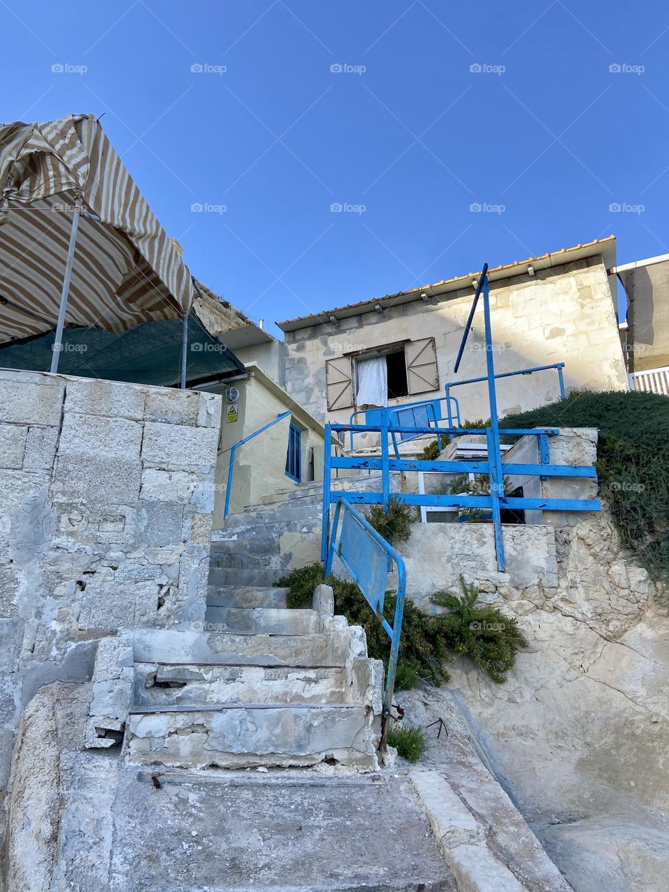 Little house up the stairs on the rock 