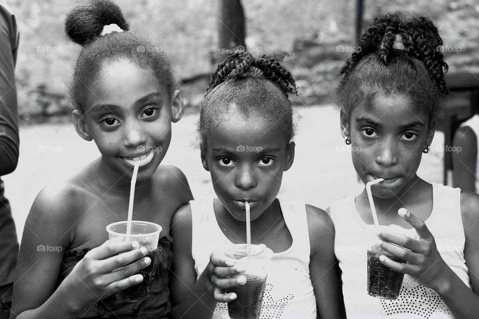 three grirls drinking cold water