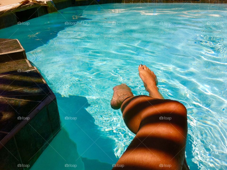 Chilling by the pool- cool shadows- tan legs tease