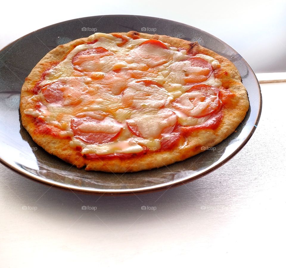 Cheesy goodness. My wife's pizza 