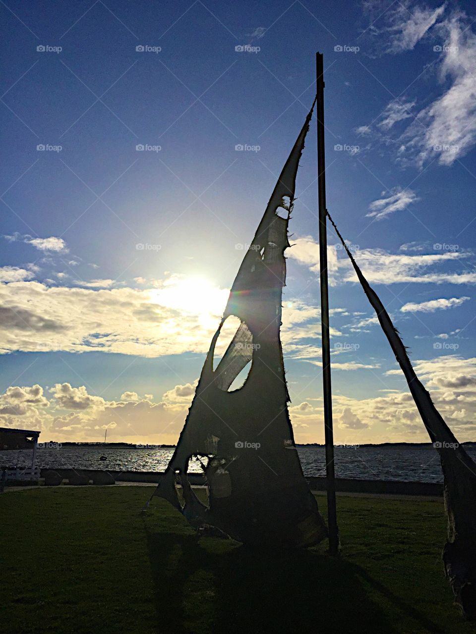 Sunset behind the broken sail! 