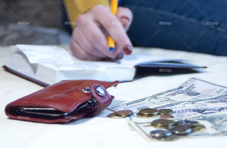 woman takes notes in notepad and says Finance