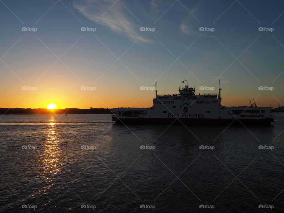 Silhouette of ferry returning to Southampton in the evening