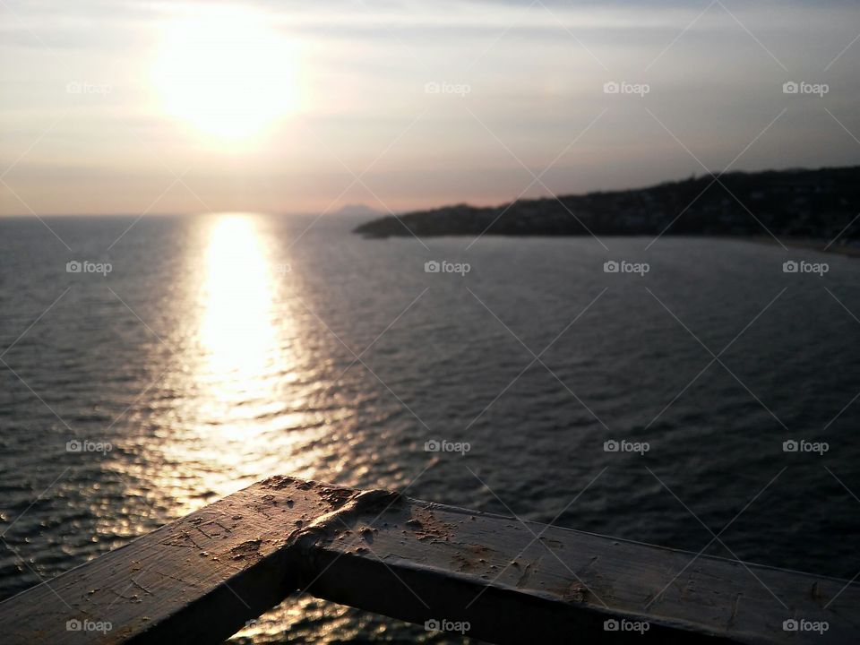 Railing pointing the sun