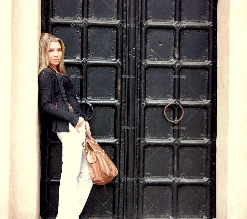 Girl near the door in Prague