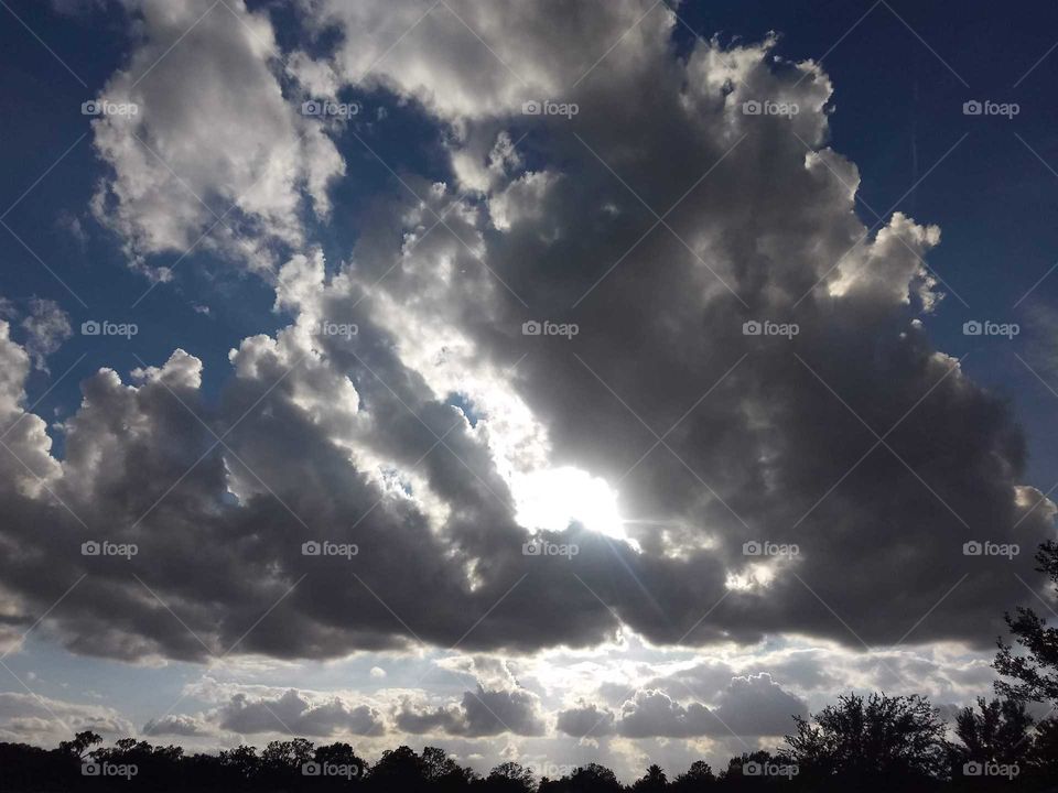 Sun shining through the clouds