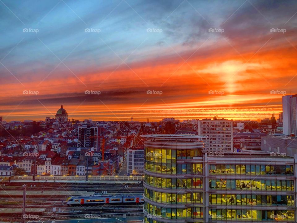 Dramatic and colorful fiery red sunrise over the city of brussels