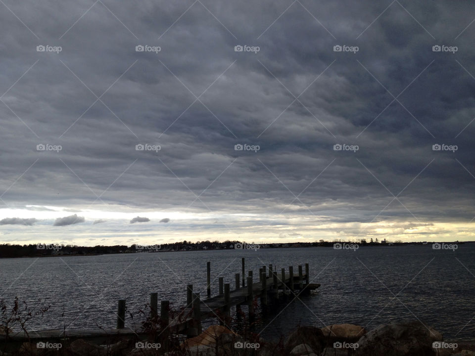 clouds water dock dark sky by drosado918