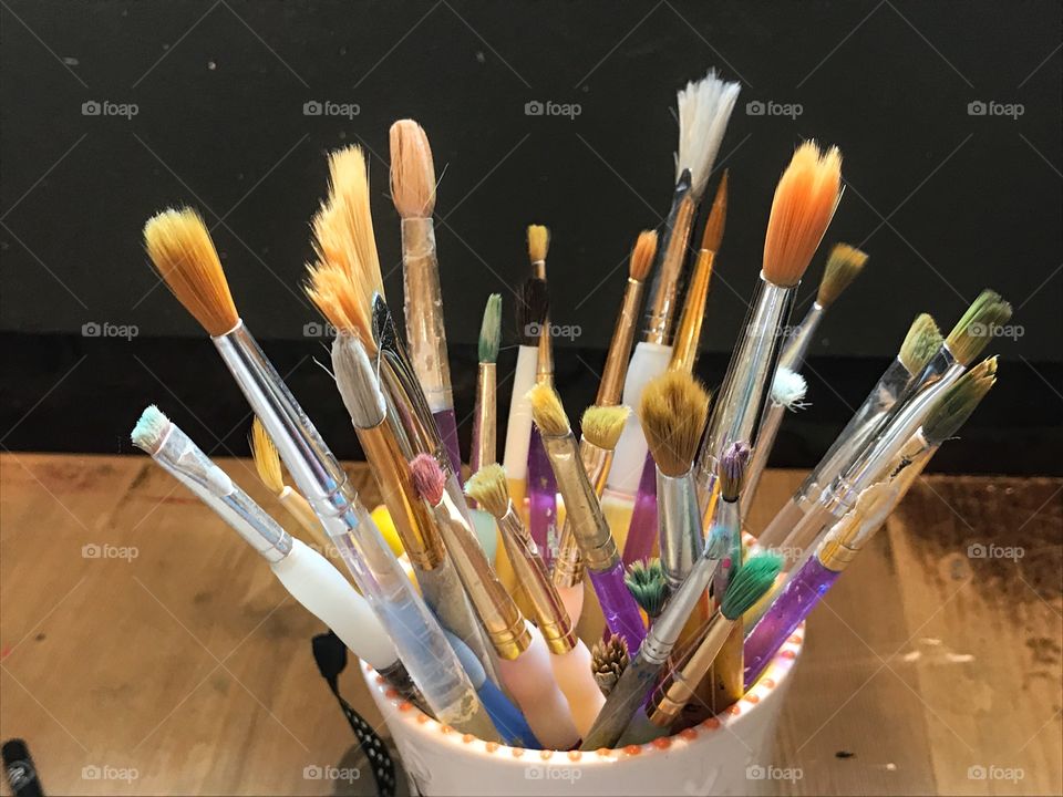 Paint brushes in a mug