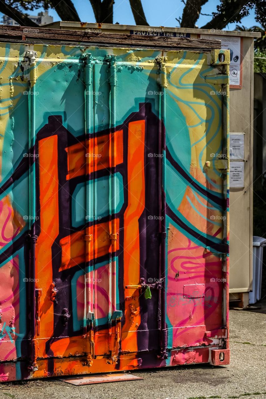 Graffiti on an old shipping container of the Golden Gate Bridge showing the beauty of street art