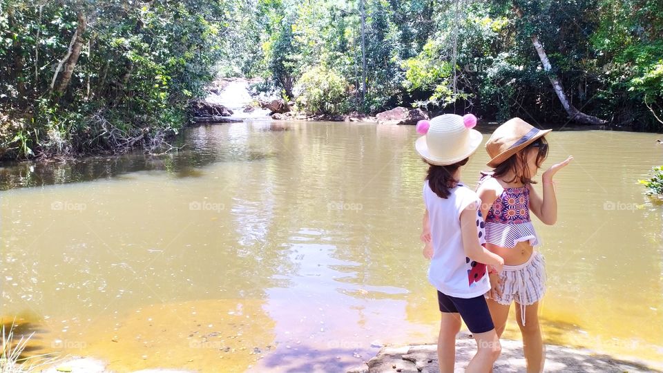 Children playing in the Atlantic Forest, Indios waterfall on the north coast of Bahia