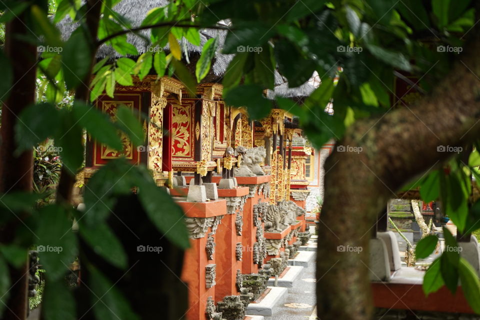 Hindu temple through the trees in Ubud, Bali, Indonesia.