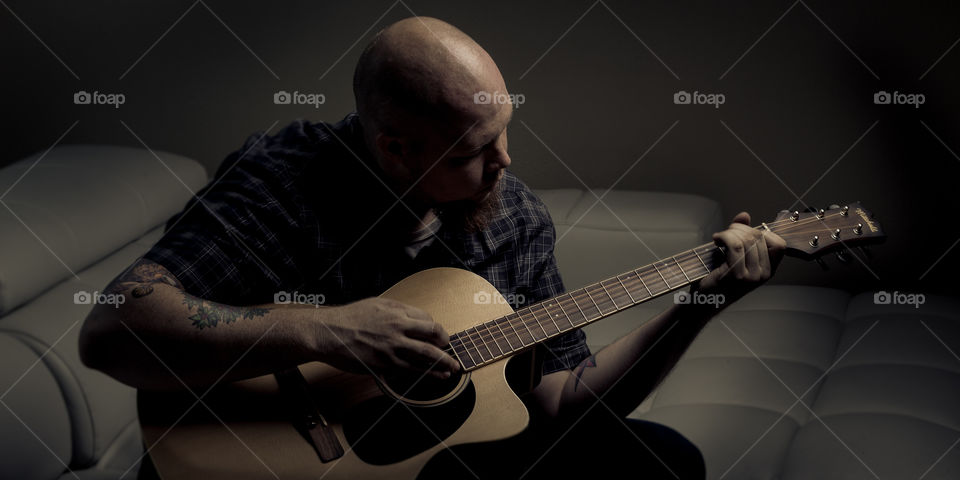 Playing guitar. Testing an old light with this one

