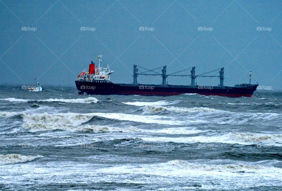 Coast guard helping a container ship