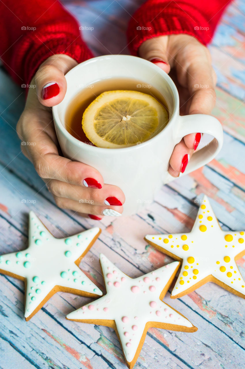 woman hand with cup of tea