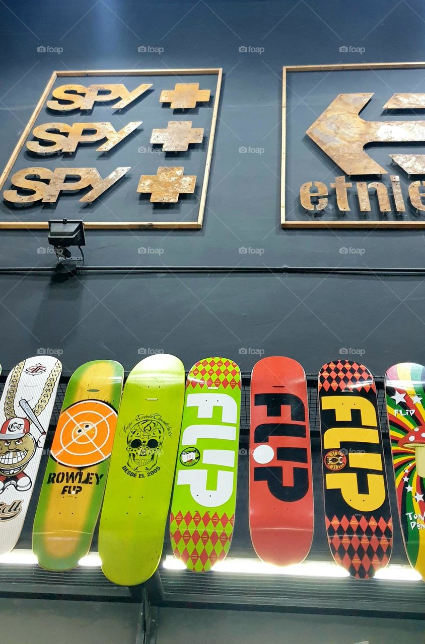 beautiful artistic and colorful decorative design with skateboards on the wall of a store in los Aviadores shopping center in Maracay Venezuela