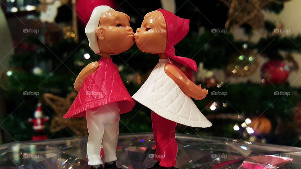 A warm Christmas kiss under the tree has the magic power to bring still to life!  Merry Christmas!