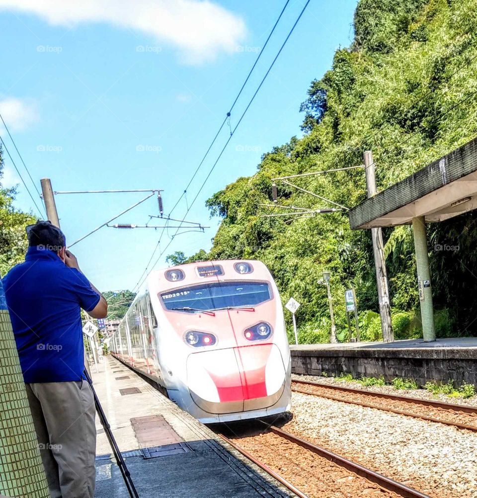 From A to B: a lovely tram stopped at a station.