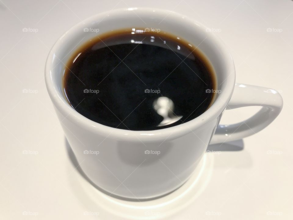 A cup of coffee.