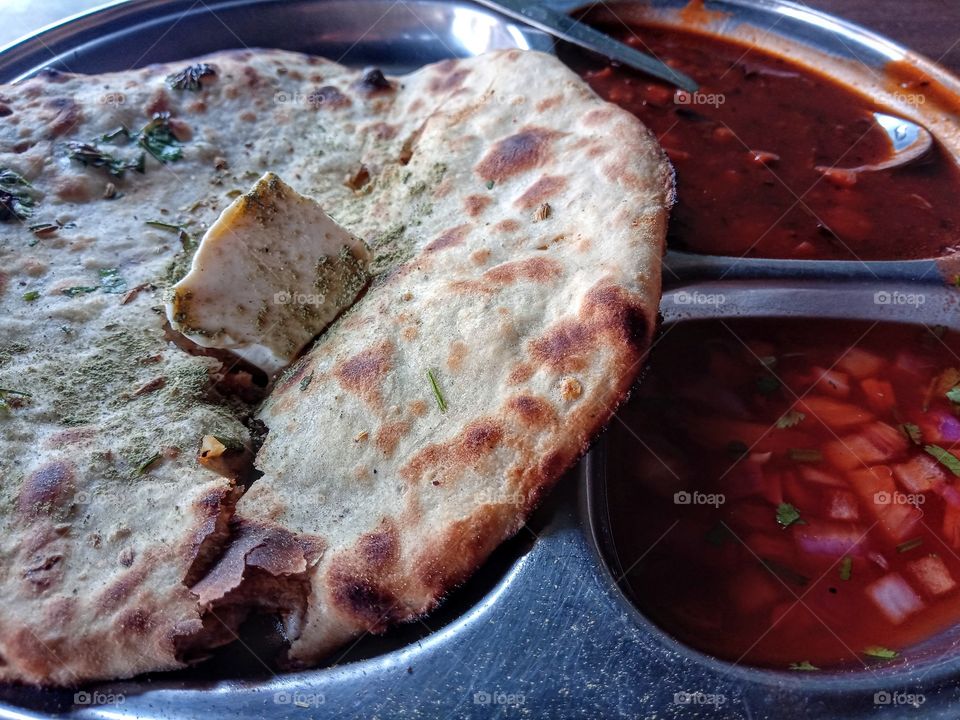 aalu kulcha with butter panjabi dish