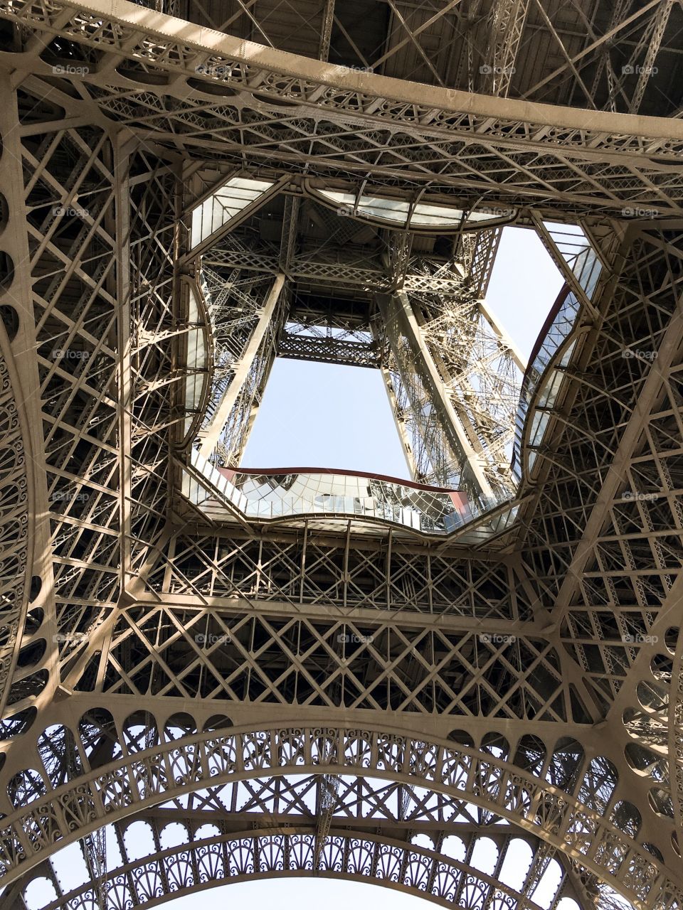 The Eiffel Tower from beneath. Some sky can be seen, but mainly the building itself.