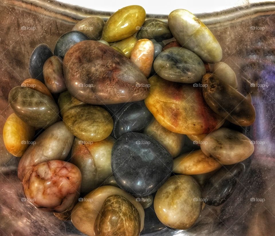 Colorful glass rocks in a jar 