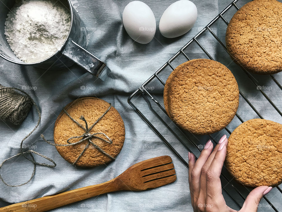 Homemade cookies with ingredients on rustic table 