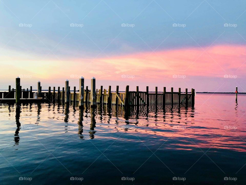 beautiful coastal sunset overlooking the water at a marina