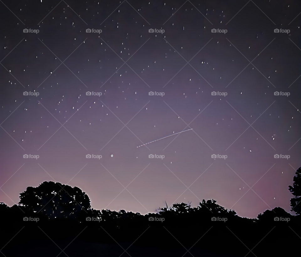 This is a long exposure of a star trail created by the International Space Station as it is approaching Jupiter.