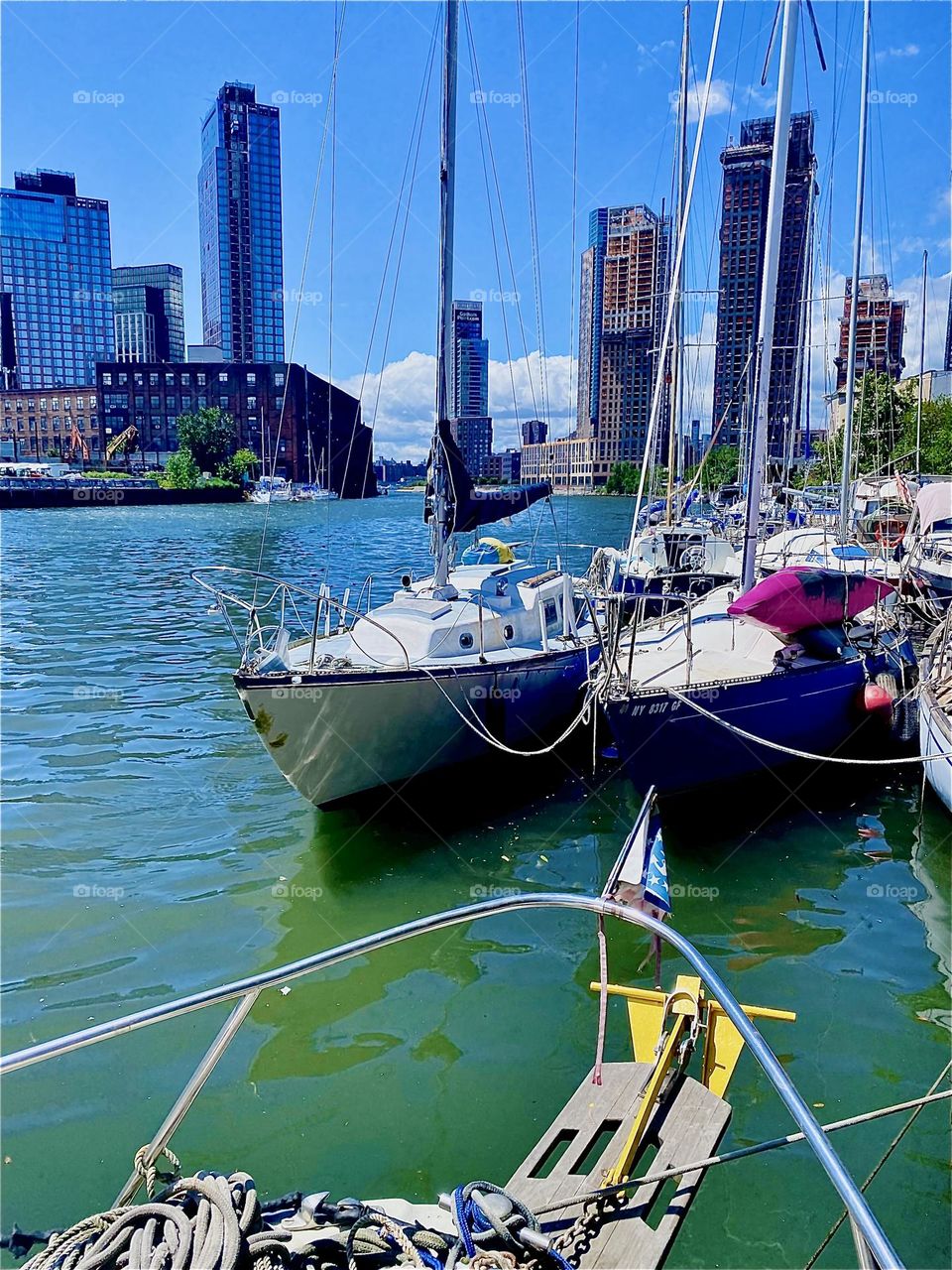The afternoon sun is especially intense today and it bathes everything here at „Newtown Creek“ by the „Pulaski Bridge“ in LIC, Queens in a beautiful golden glow. The ocean is a bright turquoise color that is unequalled. 2023. Hypnotic Productions