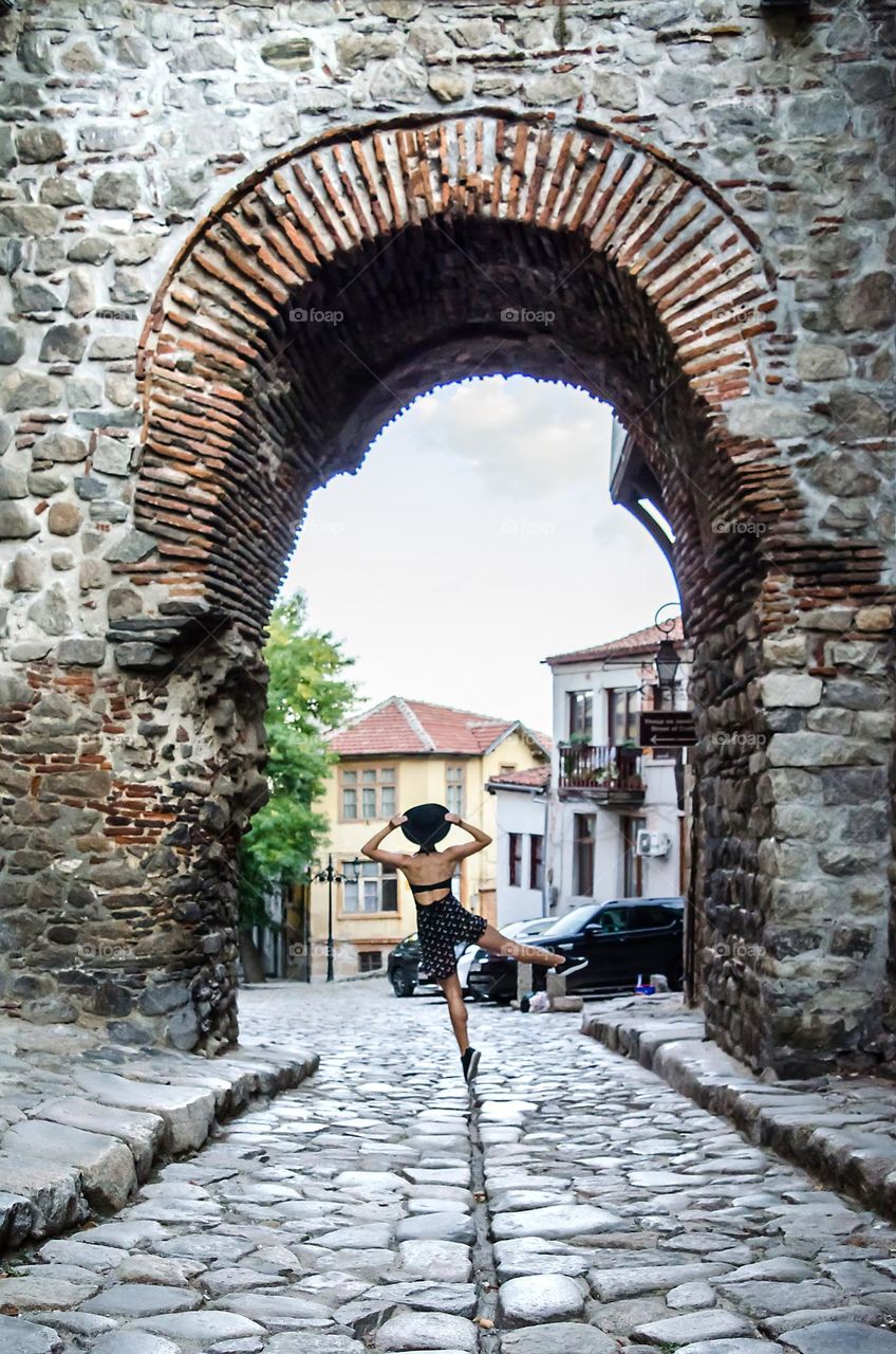 Young Female Ballerina Dancing Outside