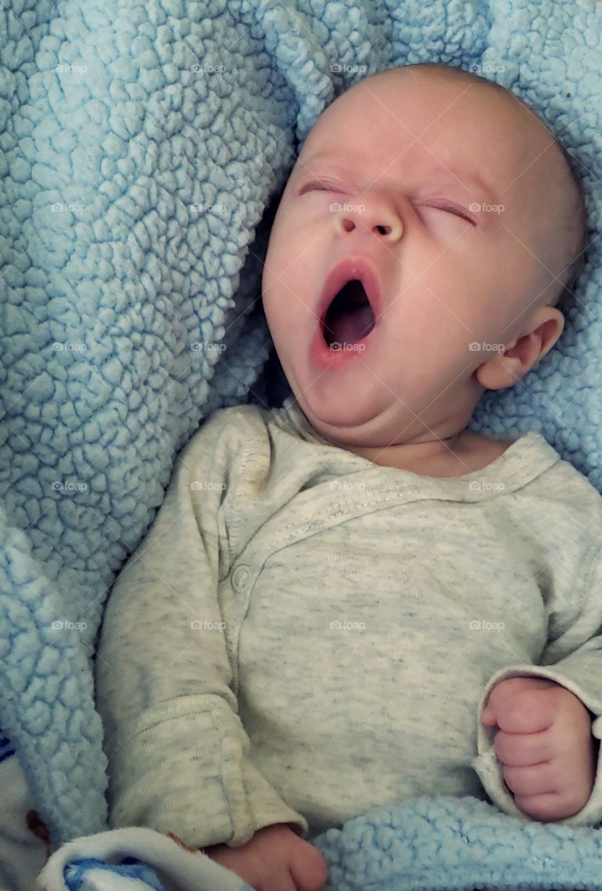 One tired little boy, that cannot stop yawning.