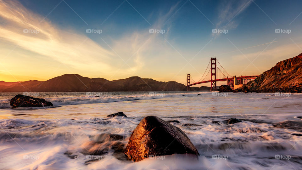 Golden Gate Bridge in the orange glow of sunset 