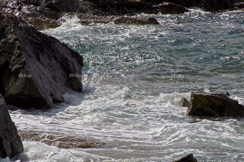 water flowing into the rocks