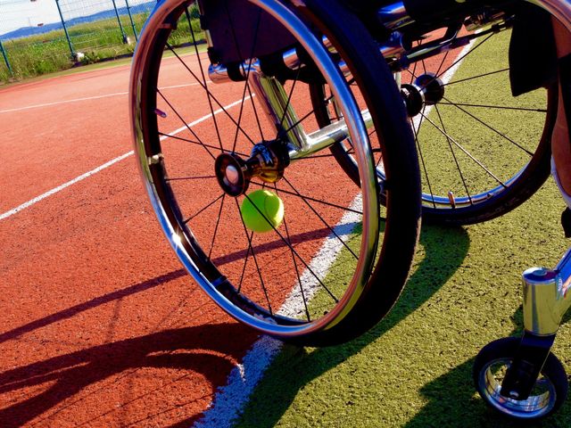 Wheelchair on the tennis court. Photo taken while playing tennis with my girlfriend