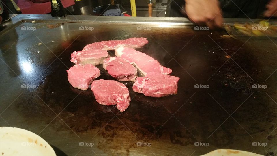 steaks on the  grill