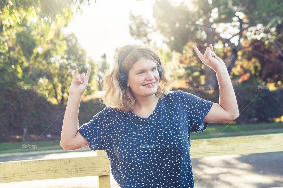 girl dancing to the music outside