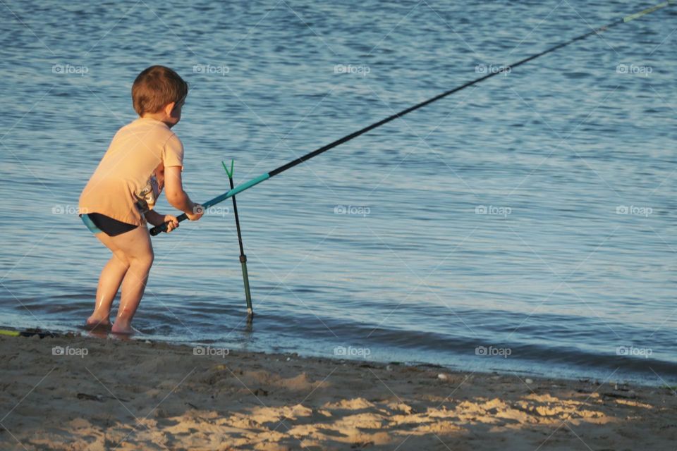 Young boy fishing