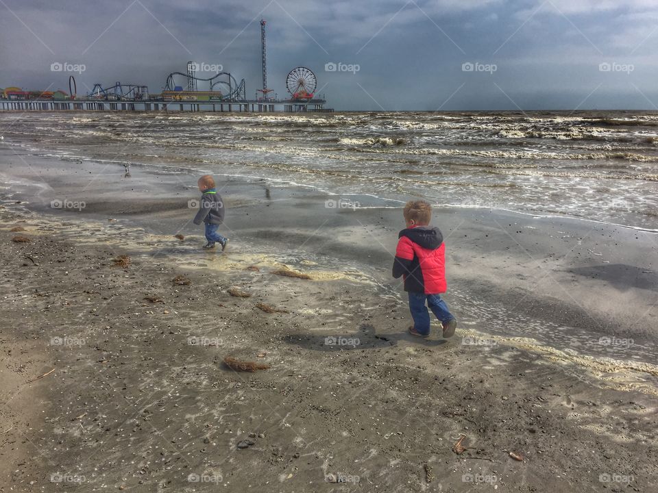 Boys walking the beach