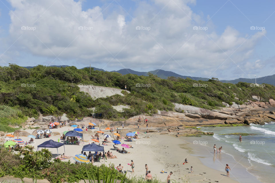 Tourists enjoy the summer on the little beach in Barra da Lagoa in Florianopolis Santa Catarina Brazil.