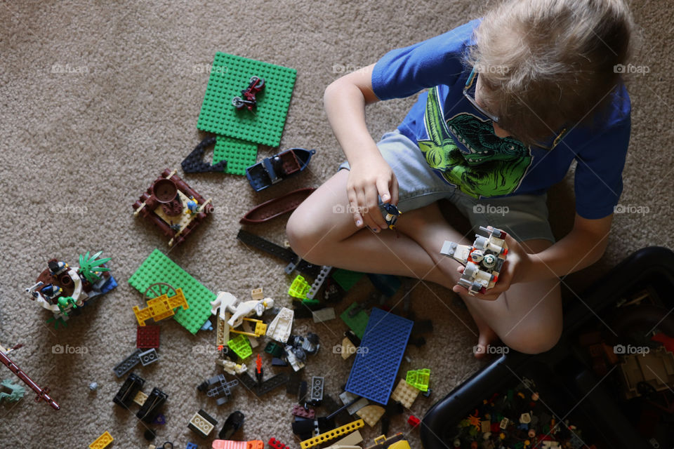 Child playing with Legos