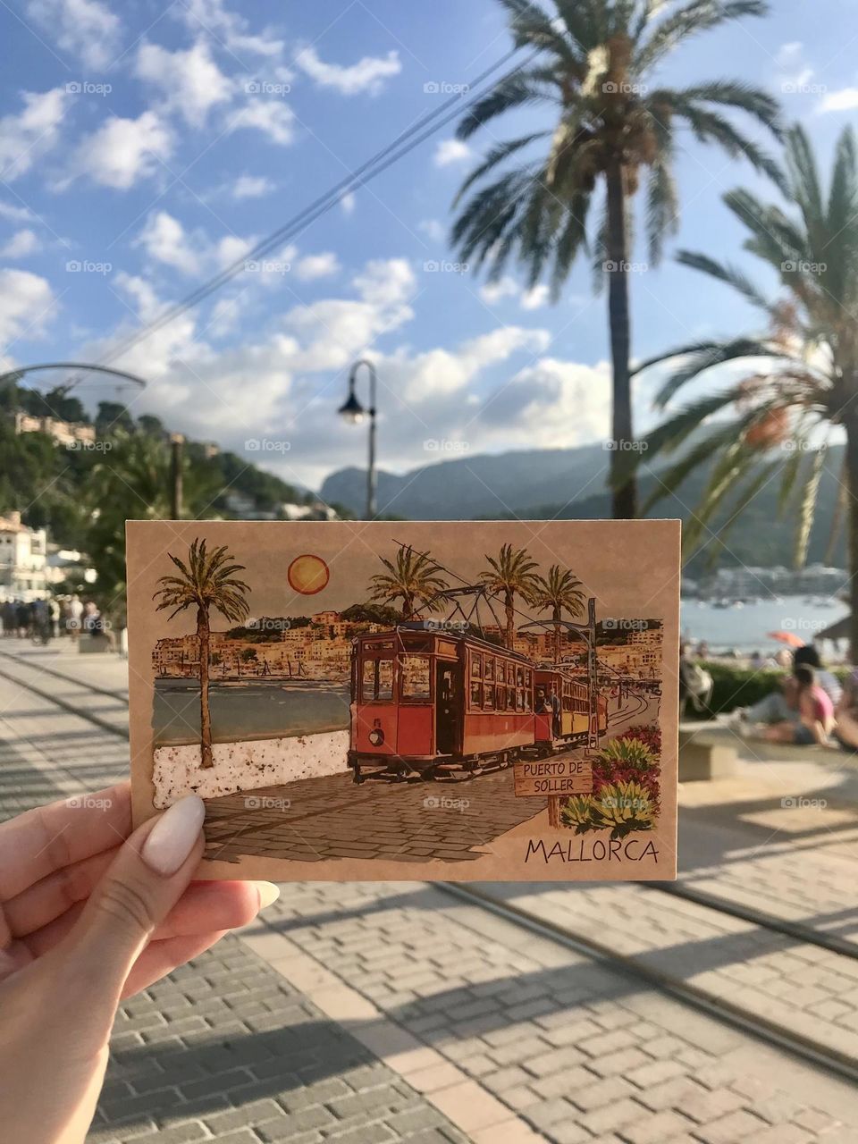 Port de S贸ller is one of my favorite destinations, and I can't wait to return to its stunning beauty and charm. The picture also features a beautiful postcard from this captivating port, a reminder of its unforgettable allure 馃