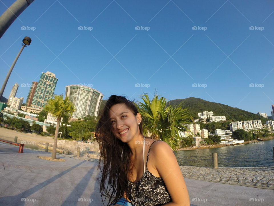 That smile!. My sweet girlfriend smiling after a day relaxing at the beach in HK