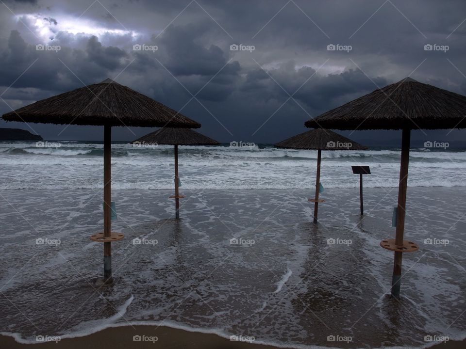 Scenic view of storm clouds over beach