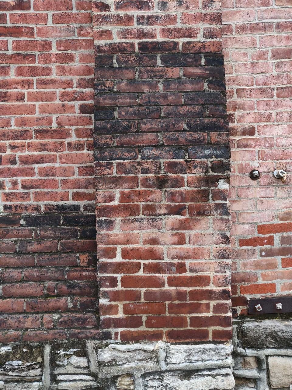 Tiered brick, sooted with time, two-step gradient.