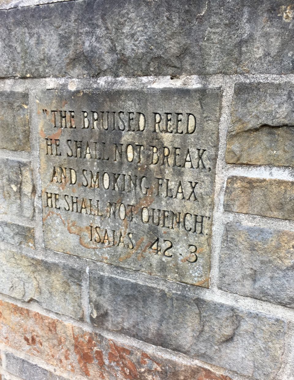 Writing on the wall. Scripture engraved in the brick of a Catholic Church in Ohio  
