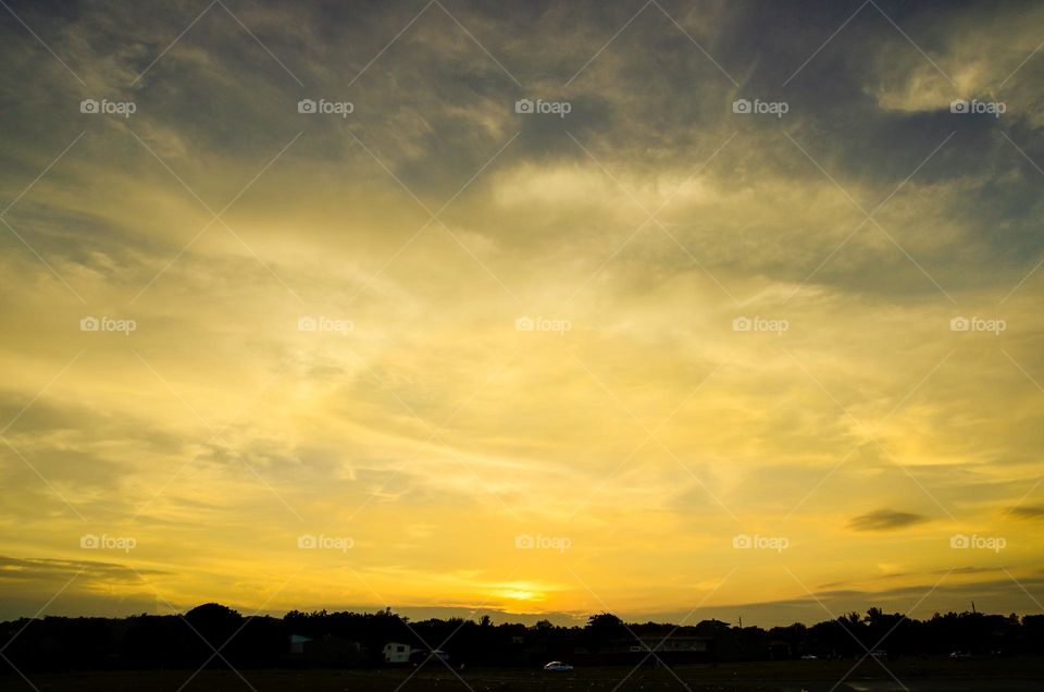 a sunset with a nice cloudy sky