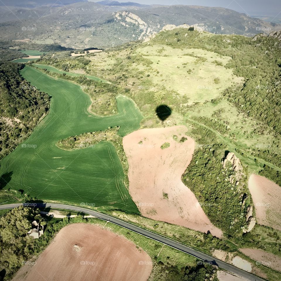 Topography sights from a hot air ballon on a sunny day allows for shadow play