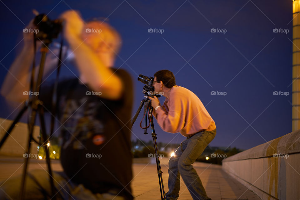 Man taking photograph with camera